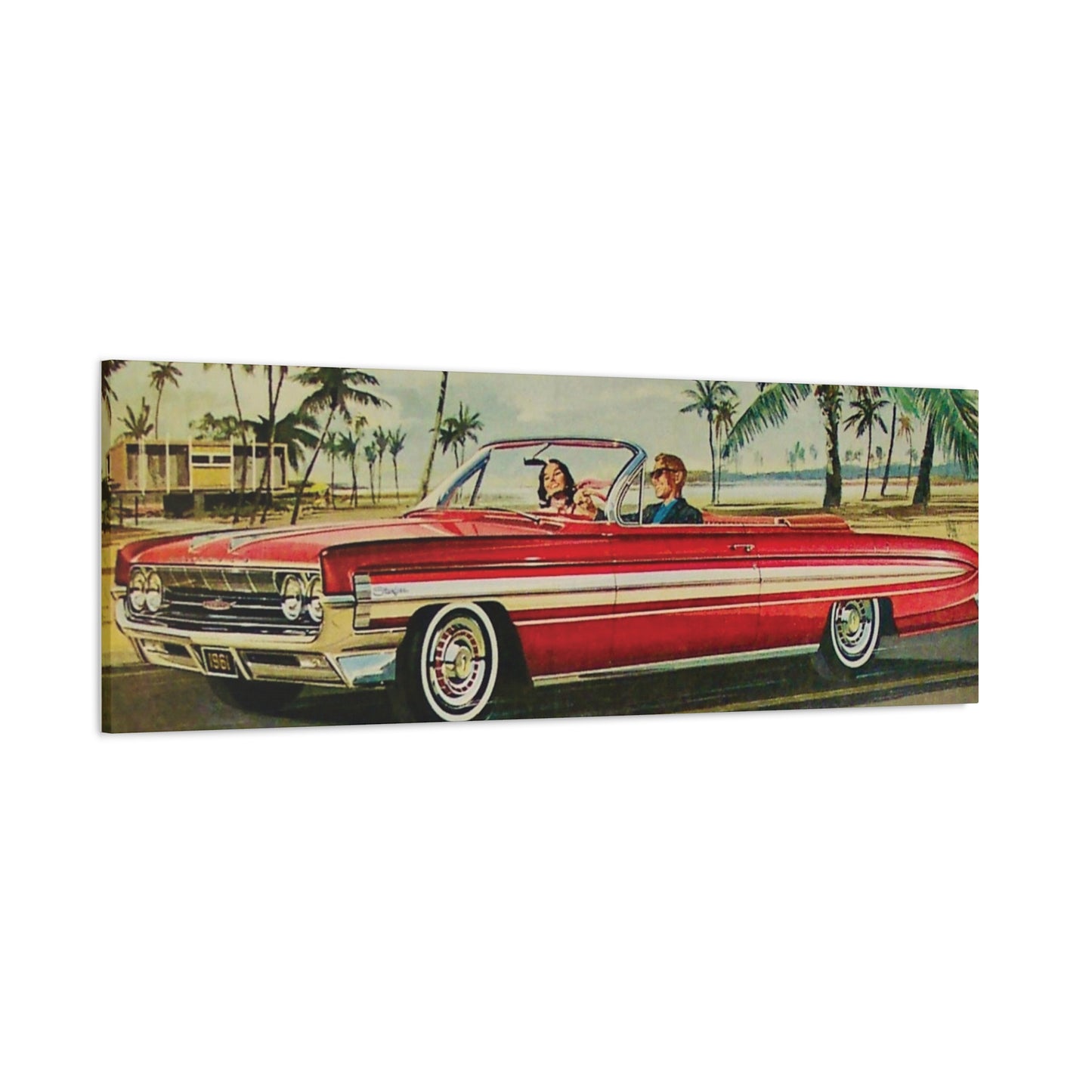  Panoramic view of a red vintage convertible car driving along a coastal road lined with palm trees.