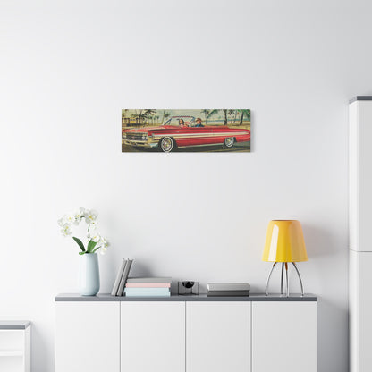  Panoramic view of a red vintage convertible car driving along a coastal road lined with palm trees.