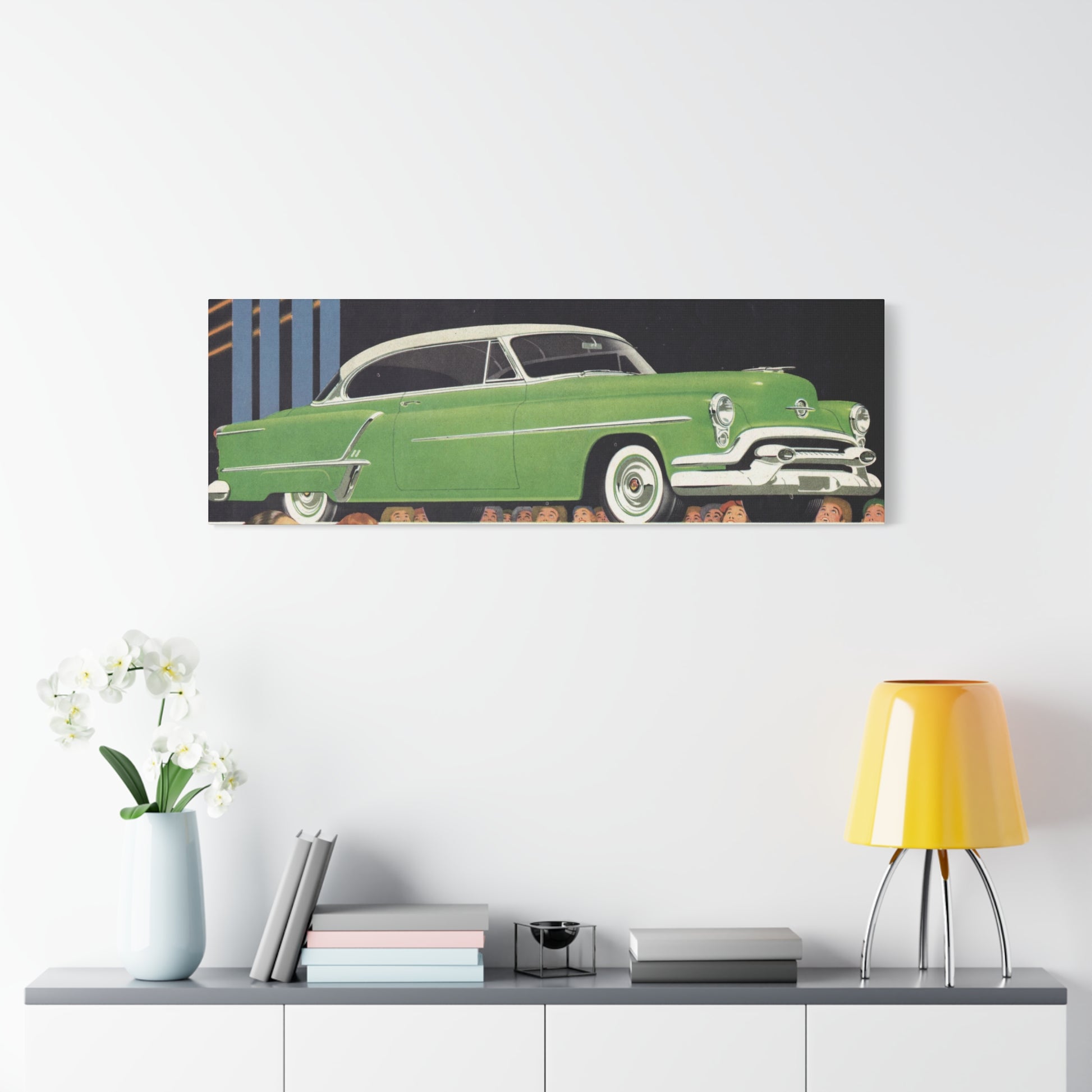 Sleek 1953 Oldsmobile 88 in vibrant green, with chrome details and white wall tires, parked in a picturesque setting