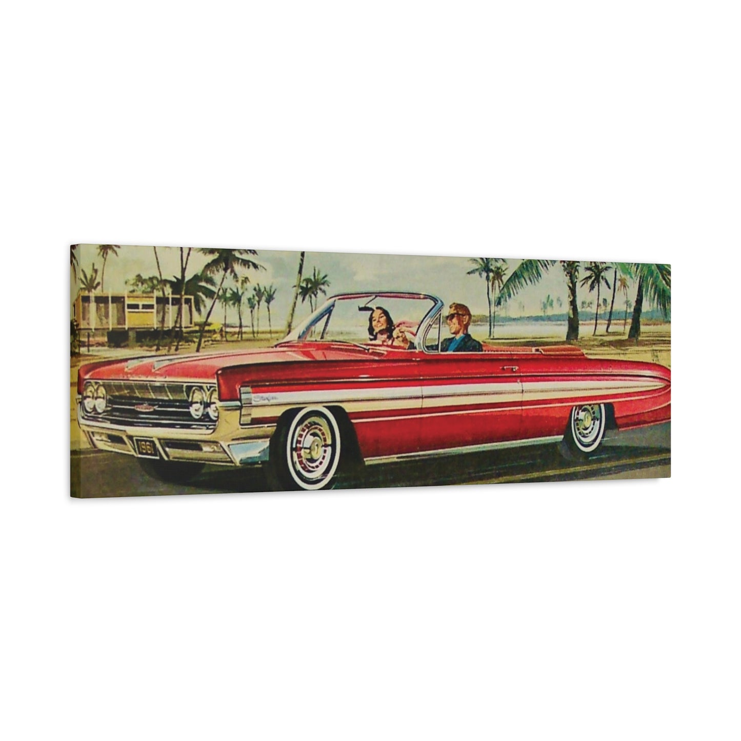  Panoramic view of a red vintage convertible car driving along a coastal road lined with palm trees.