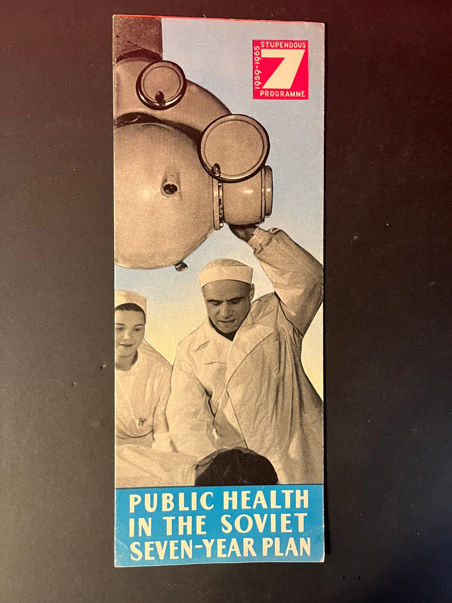 These photos display the intricate details of the pamphlet's exterior and interior, emphasizing the bold graphics and photographic images used to convey the Soviet Union's message. The interior pages are rich with period photography, optimistic healthcare statistics, and aspirational messages, all aimed at illustrating the USSR's dedication to public welfare and medical progress.